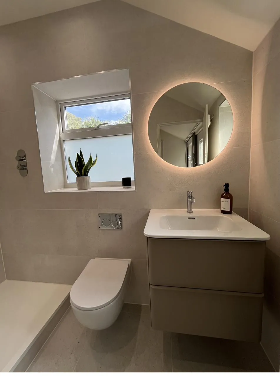 Finished ensuite with backlit mirror and sealed vanity